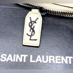 Saint Laurent Beige and Black wallet with gunmetal wristlet chain.